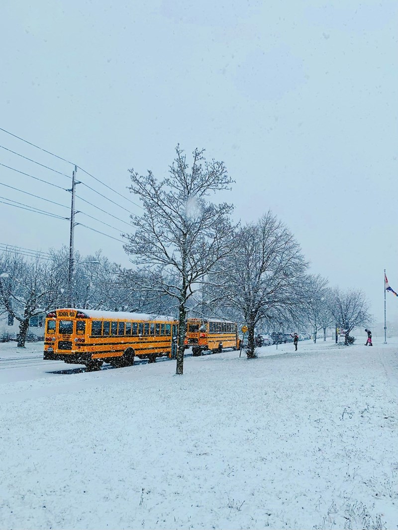 A school bus transports students to school during the freezing Canadian winter.
