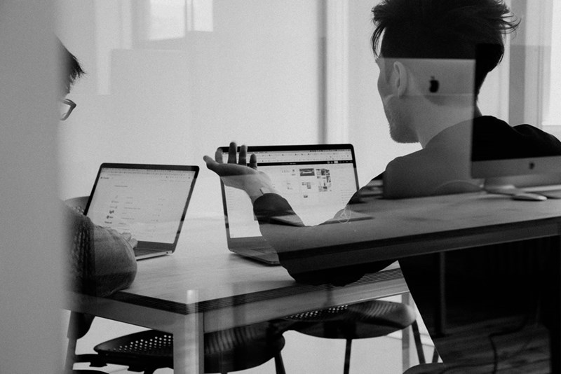 People working on their computers at an office. Representation.
