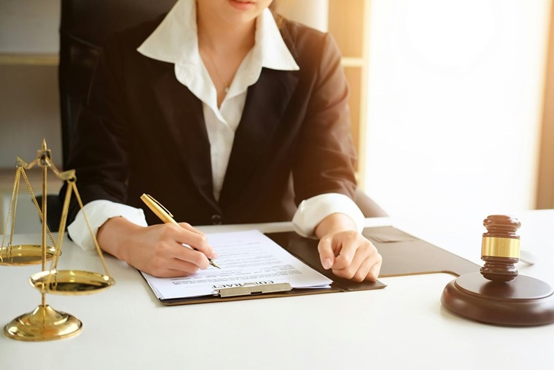 A candidate attorney works in a law office before she officially becomes a lawyer in her country. 