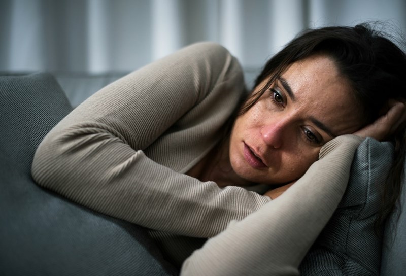 Daughter-in-law looking upset after discovering she was excluded from new family portraits.