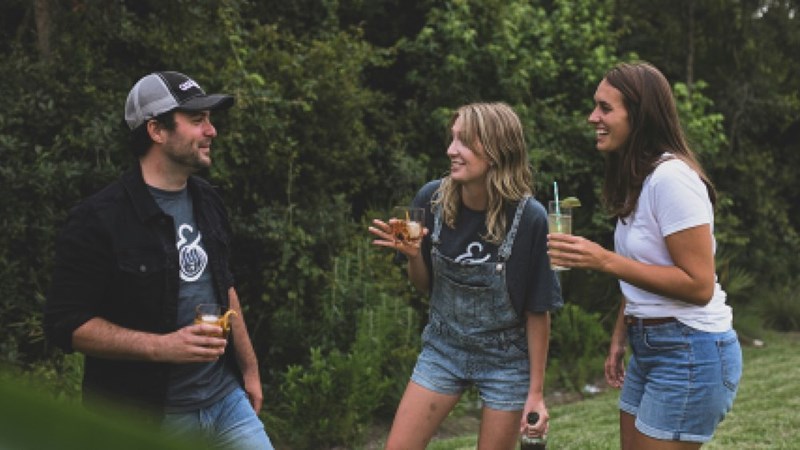 three friends hanging out outdoors