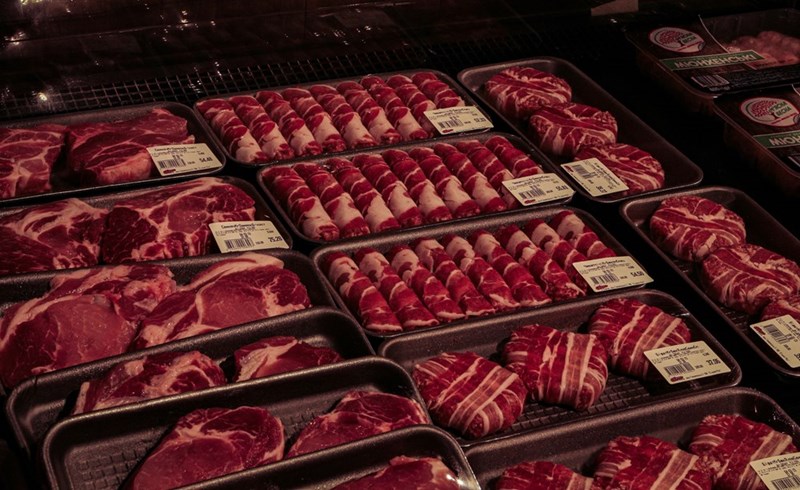 Expensive cuts of raw beef packaged for sale in a supermarket meat section.