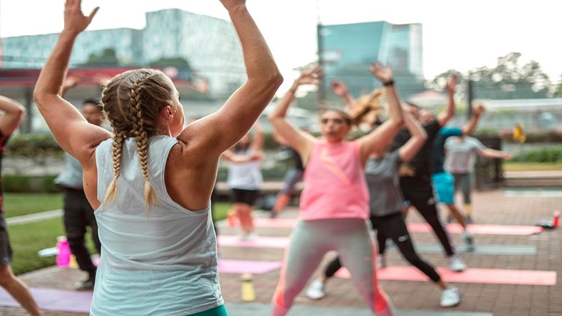 People doing exercise outside. Representation.