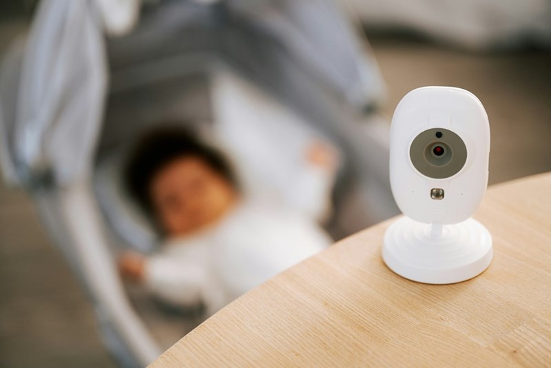 Baby monitor over sleeping newborn.