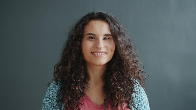 Young woman smiling in a portrait.