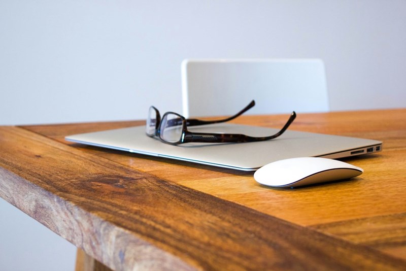 eyeglasses on gray laptop