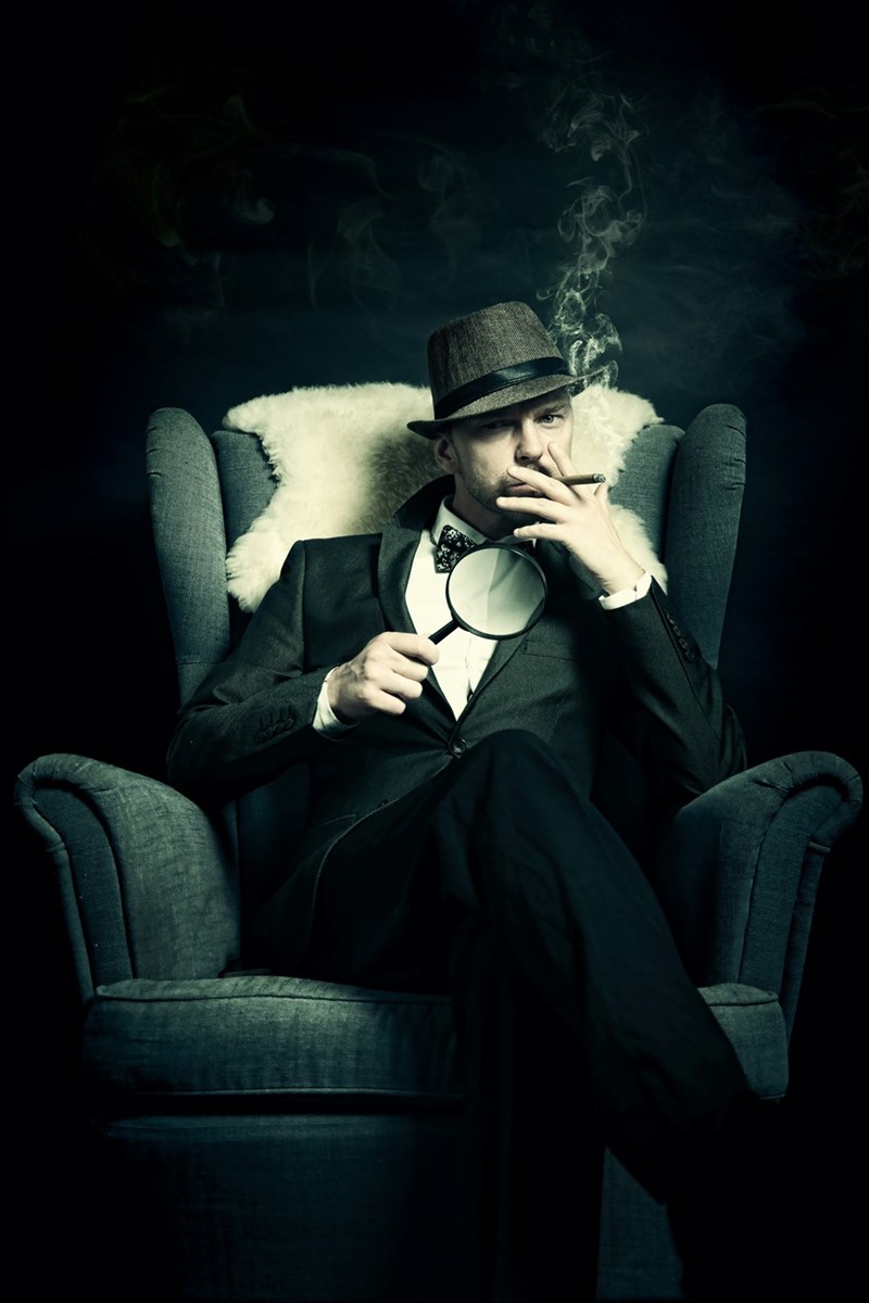 A middle-aged host of a murder mystery party. 
