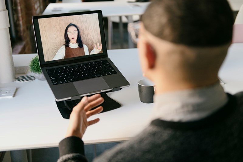 A man talks on a video call