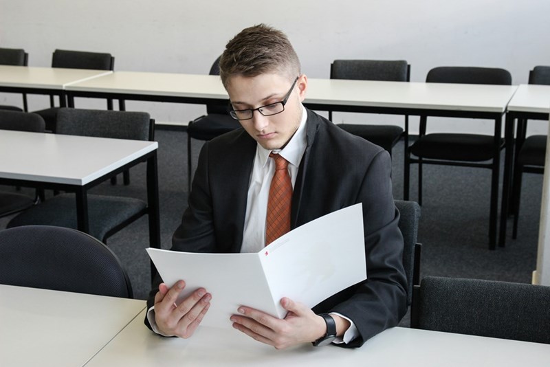 man holding resume