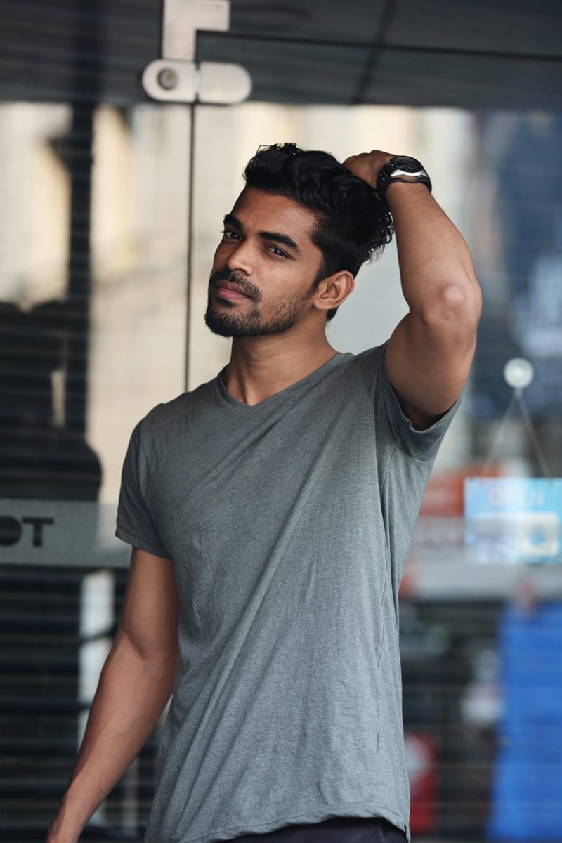 A handsome man, who someone might describe as having a Pharaoh facial structure. 