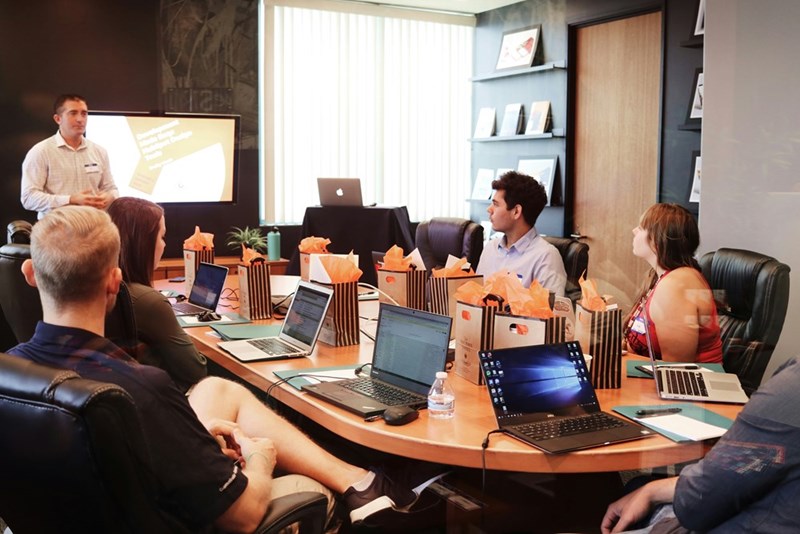 A group of people working at an office. Representation.