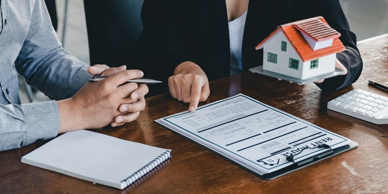Homebuyer discusses paperwork and financing as he works toward securing enough money for a down payment on a house.