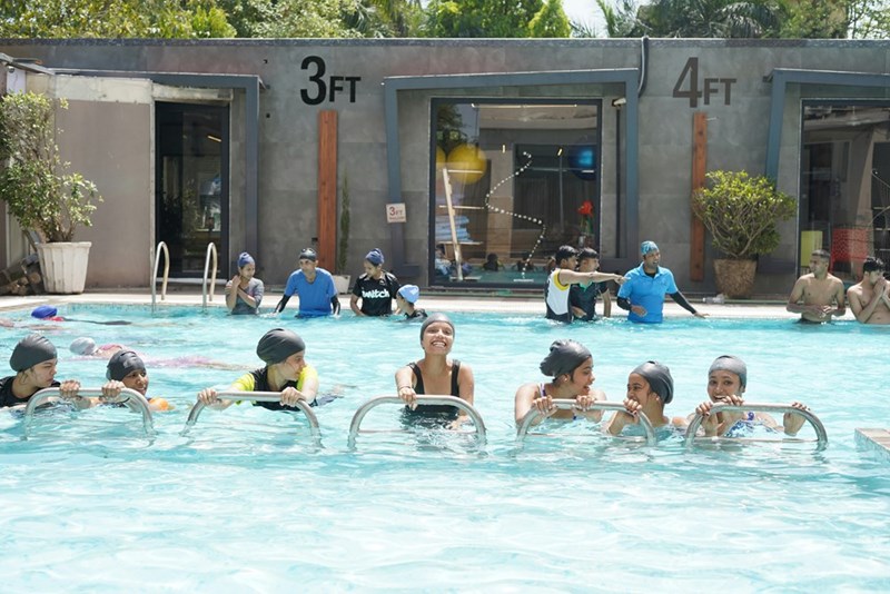 Swimmers in a local pool, illustrating the main pool that an entitled mom wanted every kid to avoid.