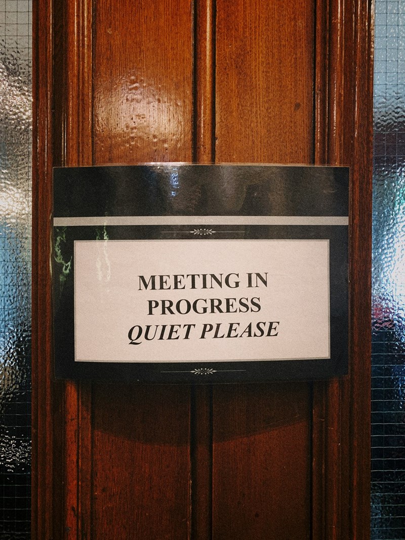 meeting in progress quiet please sign