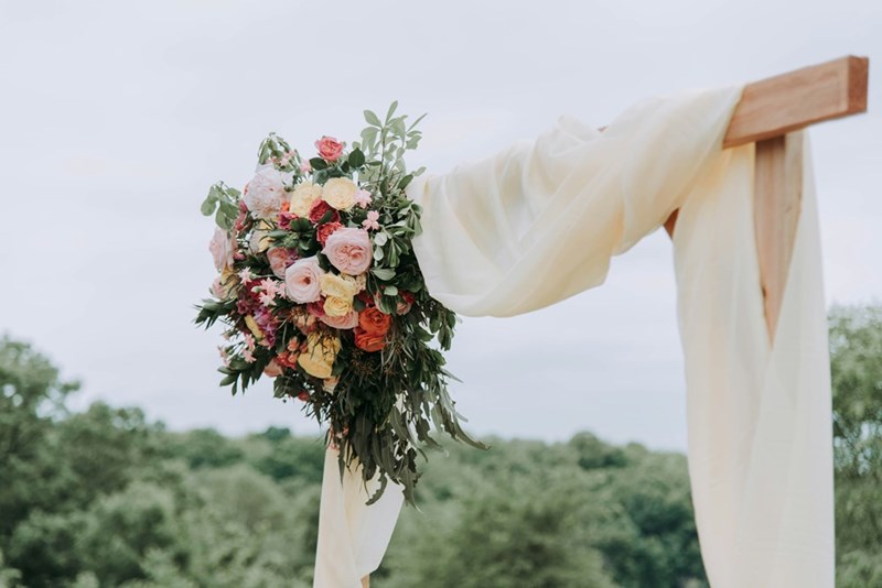 A wedding arrangement made with flowers.