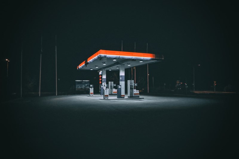 An ambiently lit gas station at night