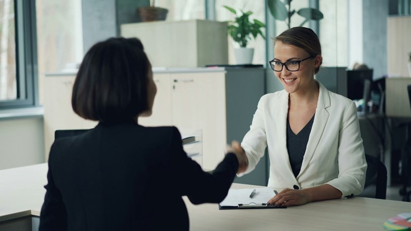 Job applicant meeting with a recruiter during the interview process for a startup role that ultimately offered no fixed financial compensation.