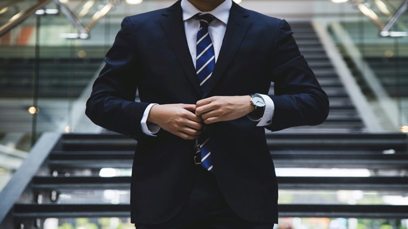 A boss controlling their employees' work time. Stock photography for depiction only.