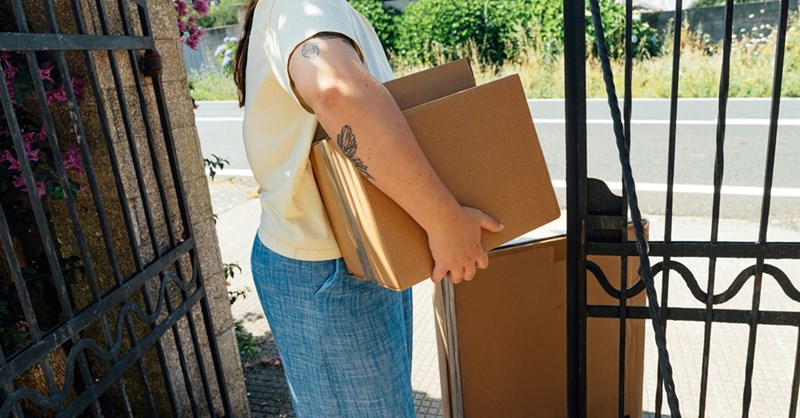 Woman throwing away sister's boxes.