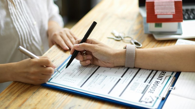 A couple signing a lease for an $8,500-per-month apartment that they will not be able to afford once their business starts to do badly. 