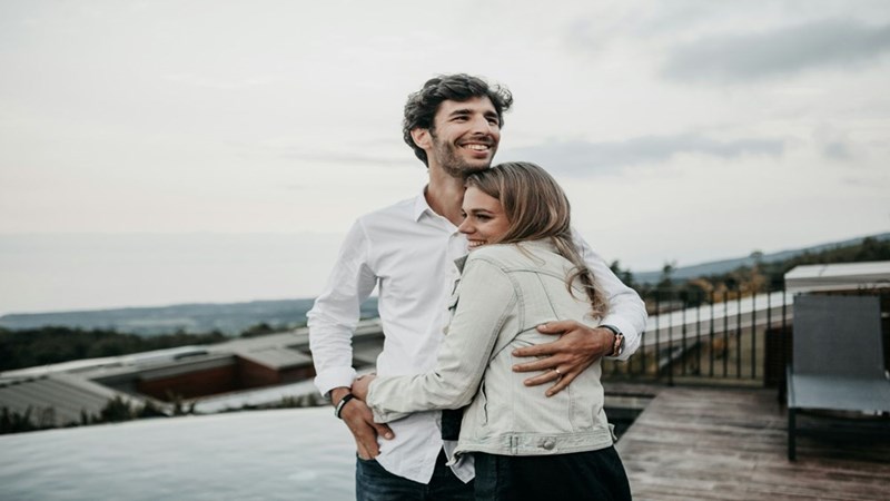 A couple of a man and a woman hugging. Model portrayal.