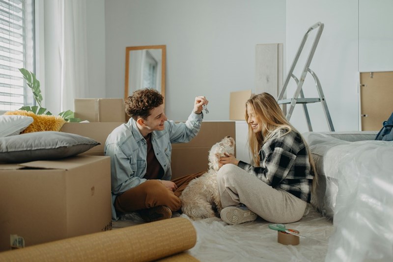A young married couple moving into their first home together.