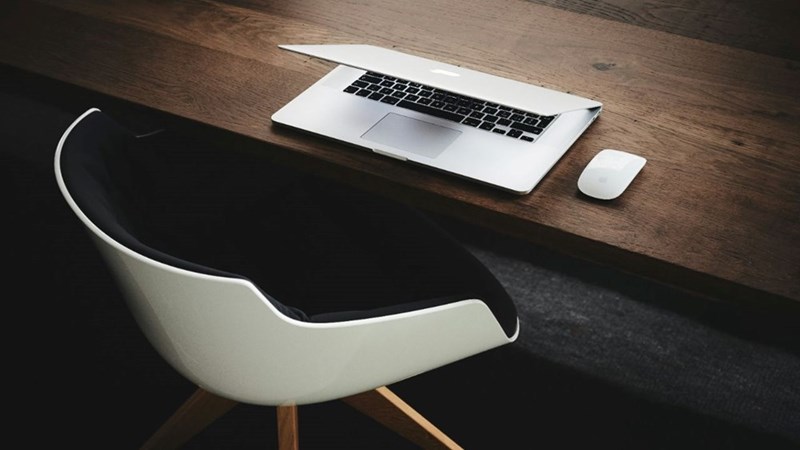 An office chair at the desk.