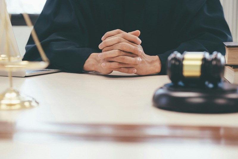 A judge is presiding over a case involving a man selling the gym equipment that his teenage son bought with his friends. 