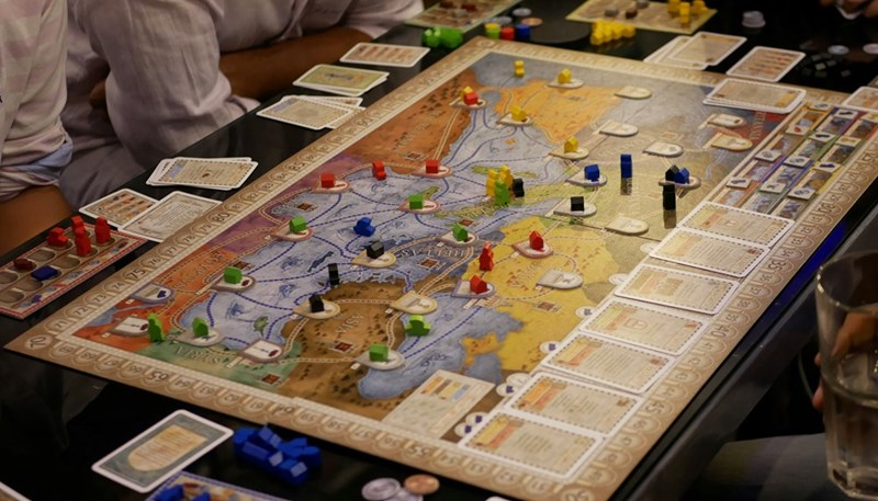 A board game set on the table for game night with friends.