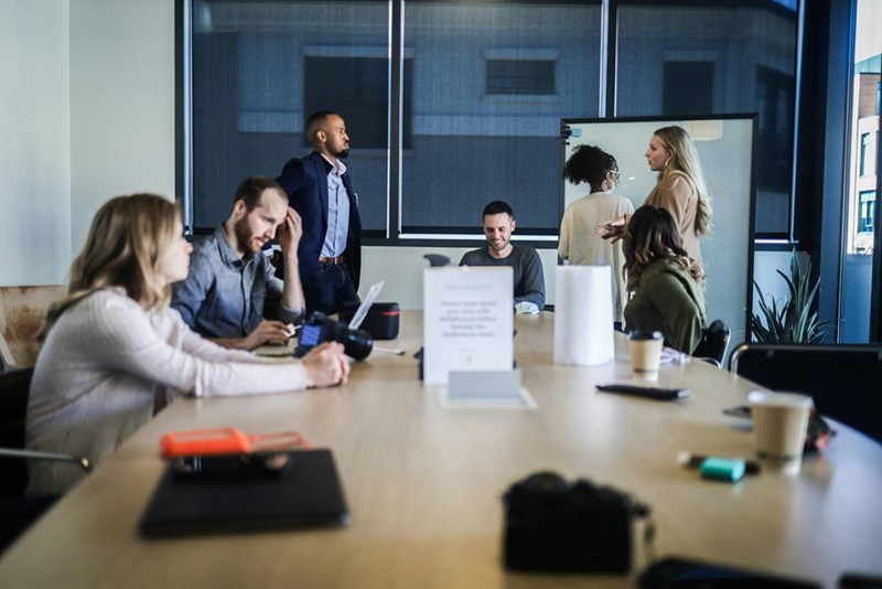 The employees having a meeting to try to recruit the former employee to help with the admin access. Stock photography for depiction only.