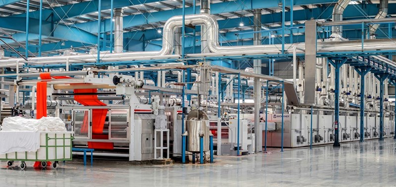 Industrial factory floor filled with manufacturing equipment.