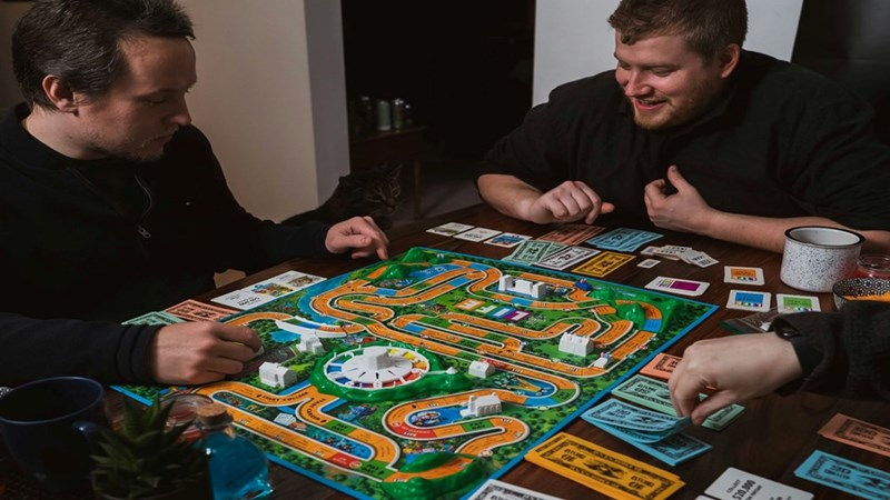Friends gathering to play board game night. Recreated scenario included to enhance reader understanding.