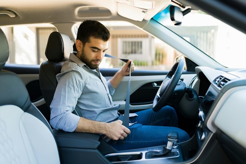 Man driving a rental car.