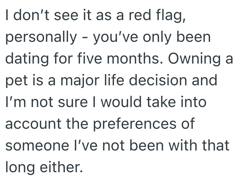 I don't see it as a red flag, personally - you've only been dating for five months. Owning a pet is a major life decision and I'm not sure I would take into account the preferences of someone I've not been with that long either.