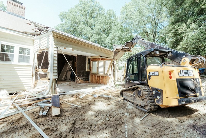 The homeowner returned to find their garage being demolished.