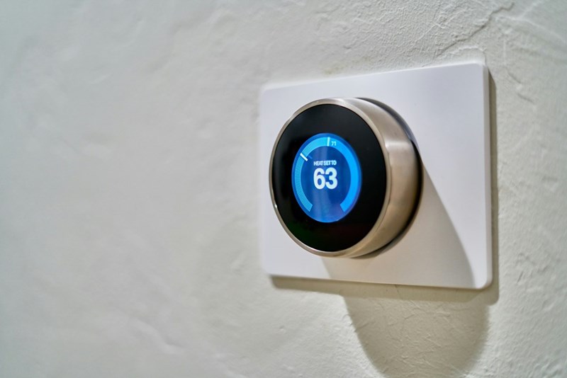 AC thermostat set to a low temperature as roommates disagree over how cold to keep their shared home.