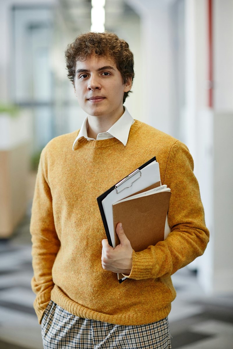 A young man in an office.