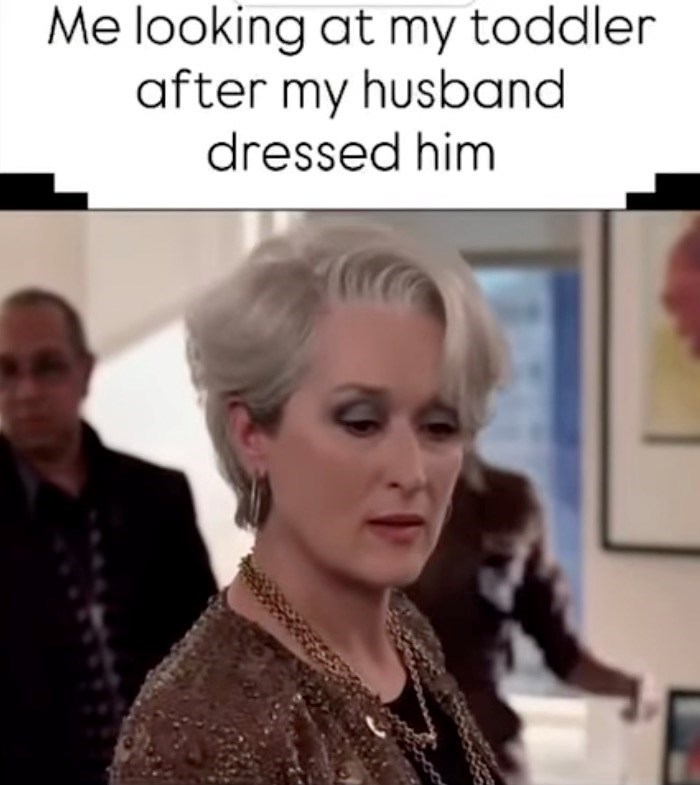 Me looking at my toddler after my husband dressed him