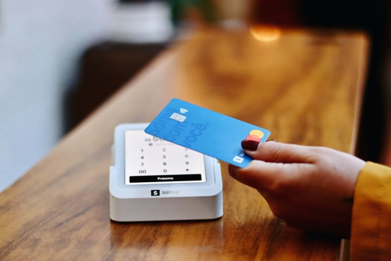A person making a credit card payment.