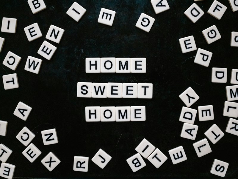 Scrabble letters spelling “home sweet home”.