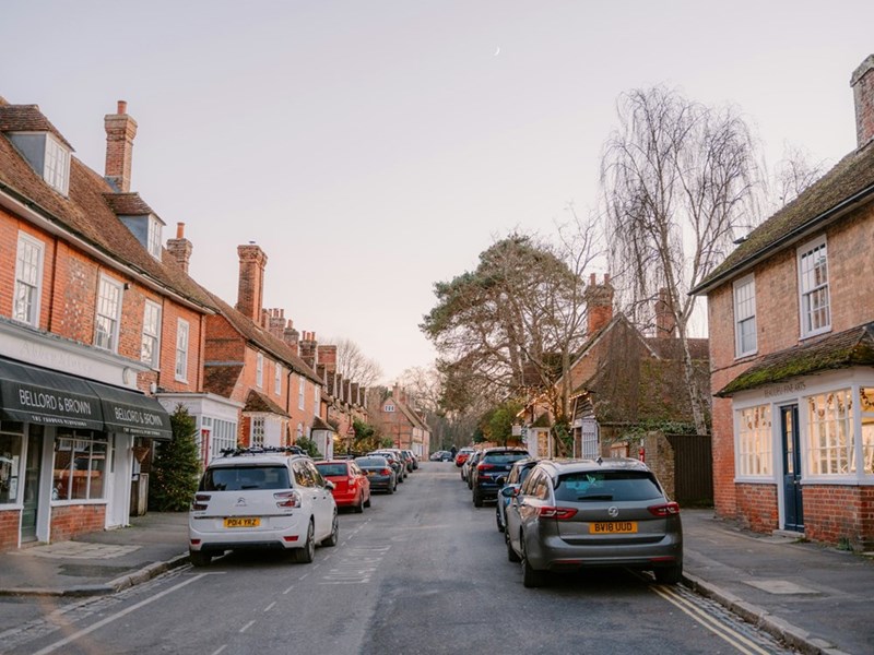 A row of cars on a UK street.
