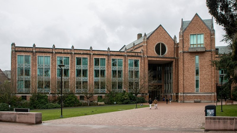 A brick building stands on a cloudy day