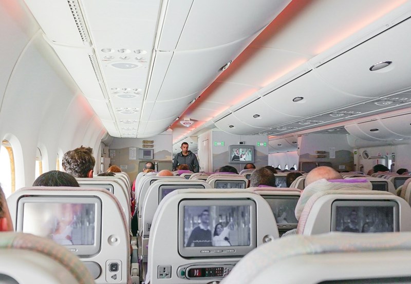 An airplane from the inside full of passengers.