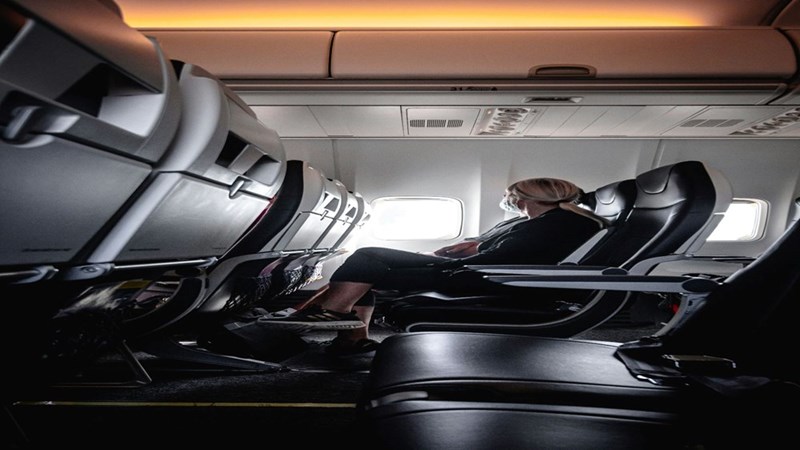 A woman sitting in her assigned seat on a flight. Image is representative only and does not depict the actual subjects of the story.