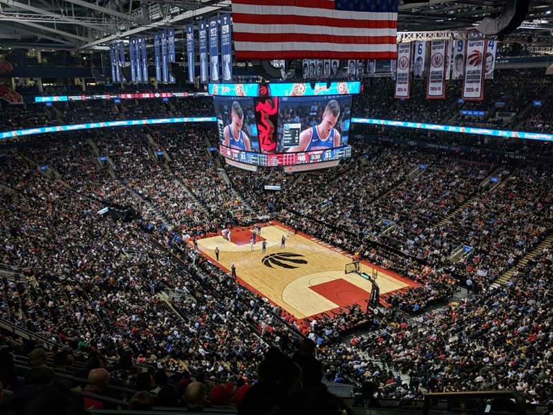 Basketball arena with large flag