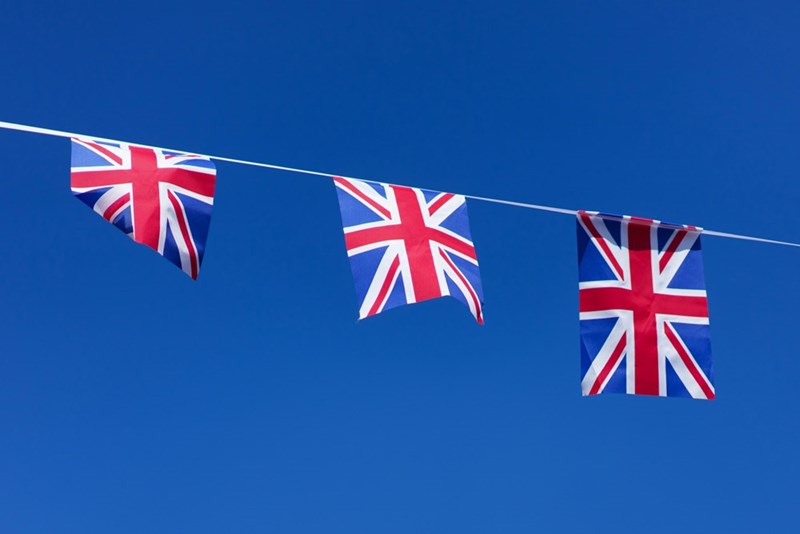 Three British flags hanging on a clothes line
