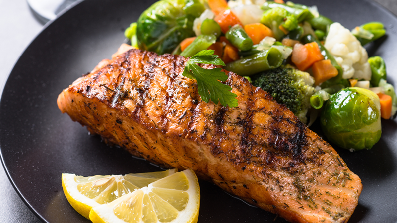 Grilled Salmon Fillet with Vegetables on a Plate