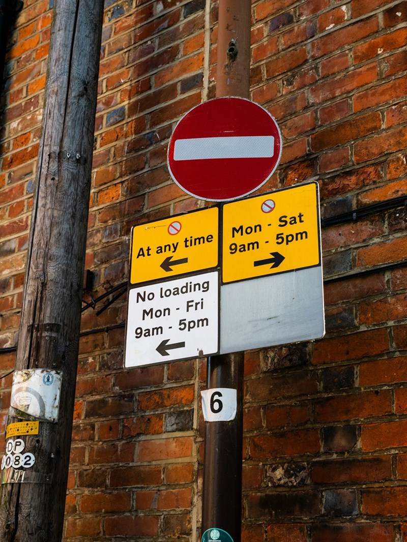 A parking sign outlining the parking rules.