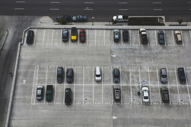Parking space occupied by different cars.