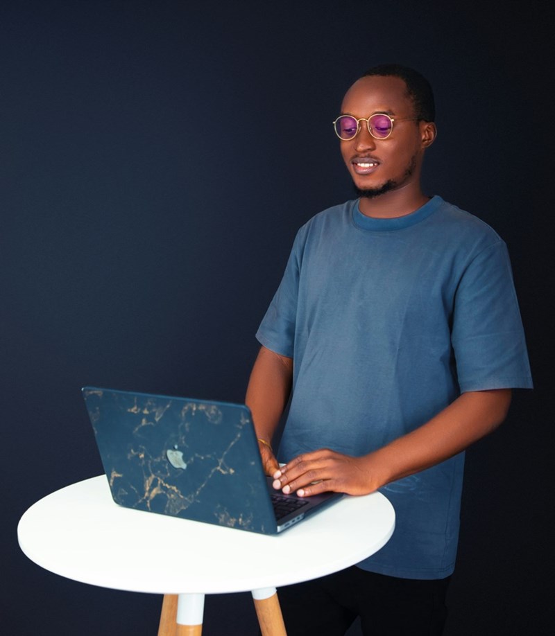 A new employee works on a laptop.